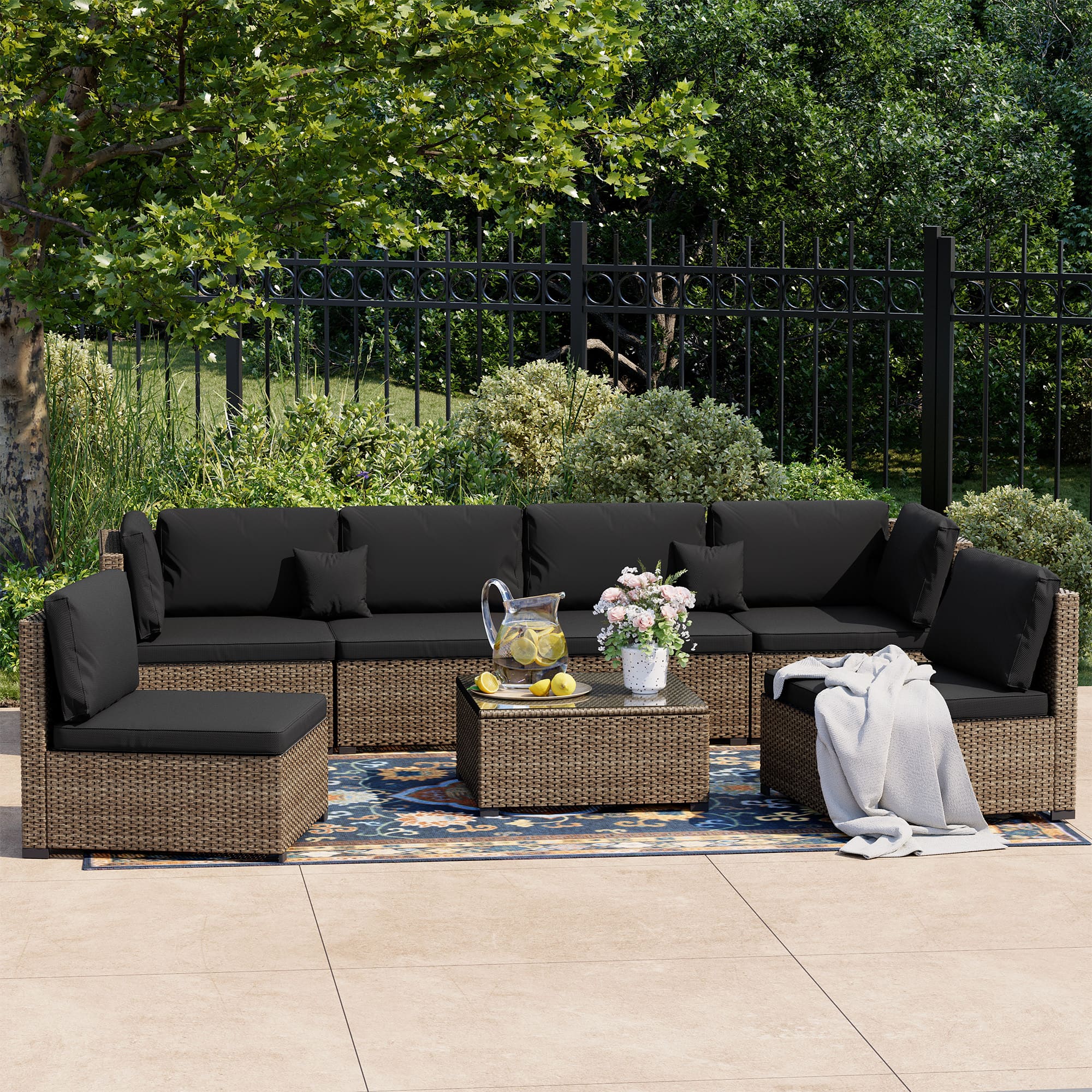 7-Piece Rattan Patio Furniture Set Arranged on Backyard Deck