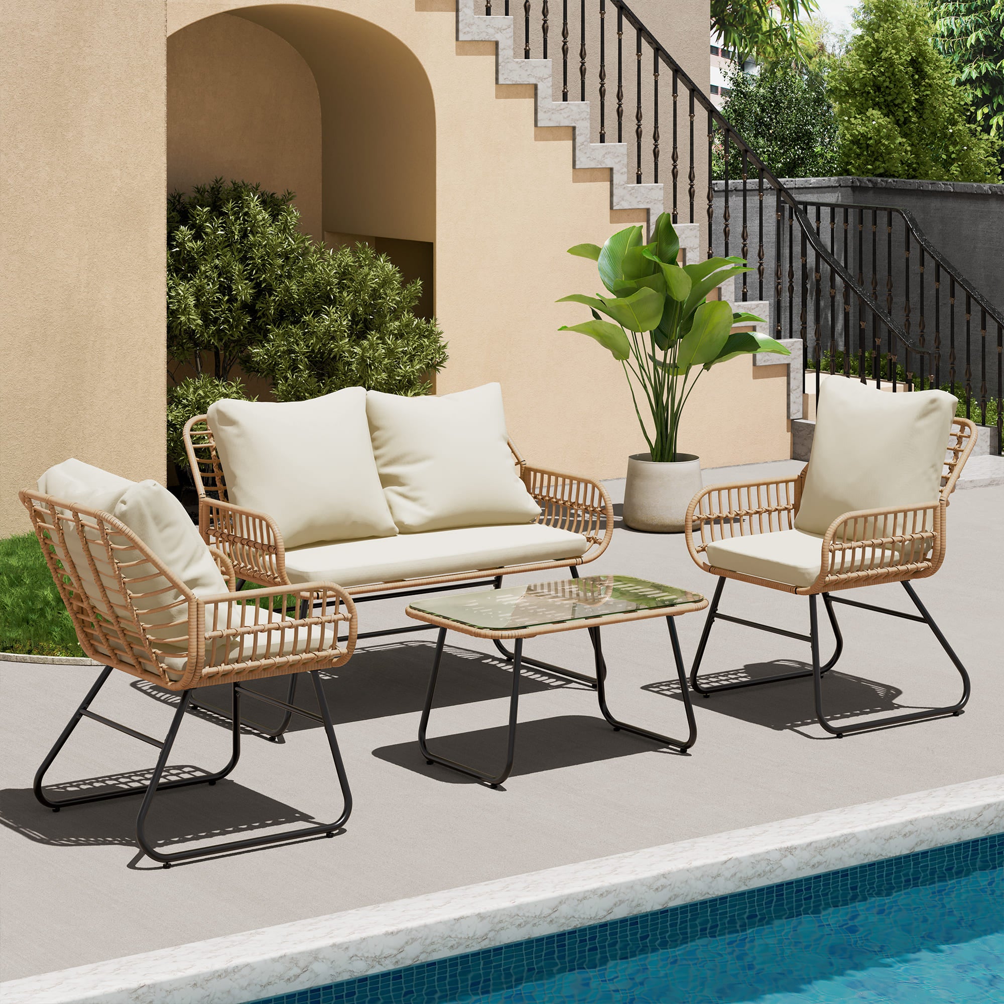 Outdoor rattan furniture set with 2 chairs, loveseat, and glass-top table