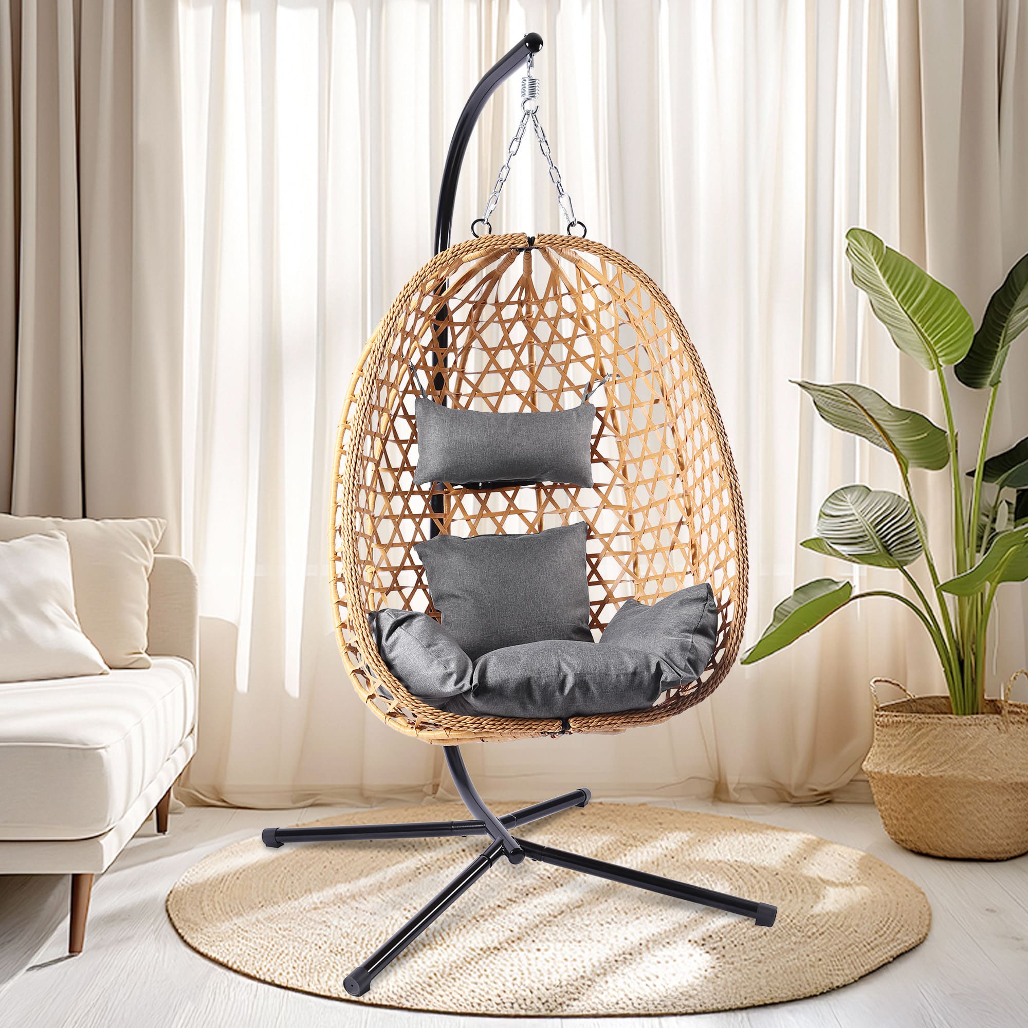 Woven egg chair with gray cushions in a living room setting